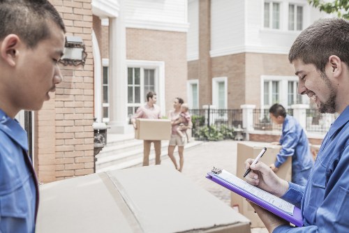 Professional home moving team planning a White City relocation