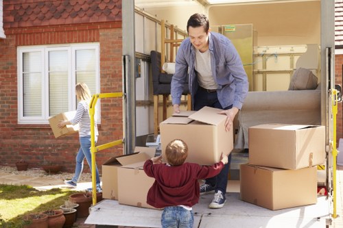 Man with van helping with boxes and household items