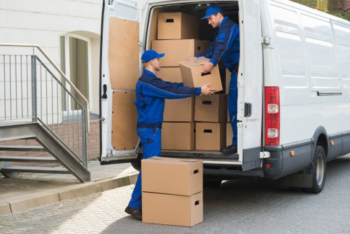 Local mover loading furniture in a White City street