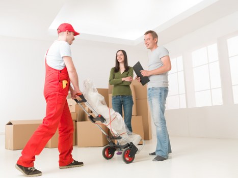 Furniture being carefully moved from a White City apartment building