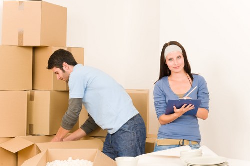 Packed boxes and furniture prepared for house removals in White City